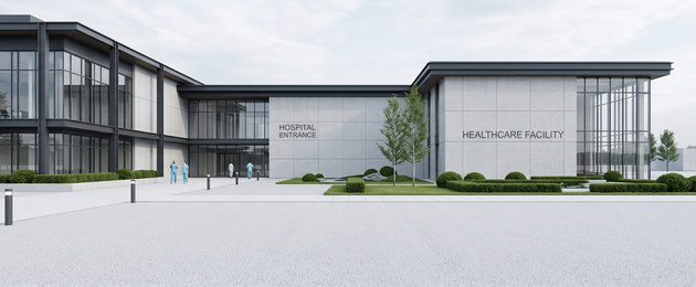 The entrance elevation of a modern hospital, staff crossing the forecourt